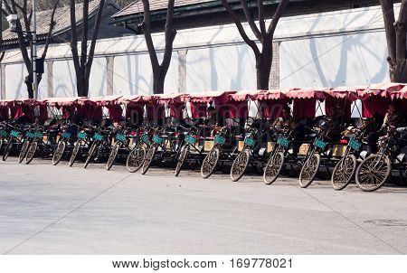 Beijing, China - March 26, 2015: Pedicabs Lined Up On A Street In Historic Downtown Beijing