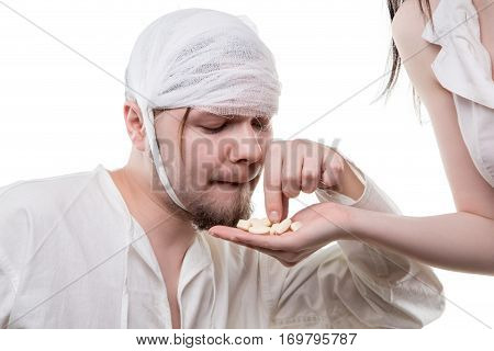 Sick man and analgetic drugs on white background