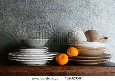 Set of dinnerware on gray background