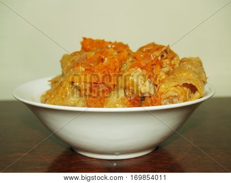 stuffed cabbage is a dish of stuffing wrapped in cabbage leaves.