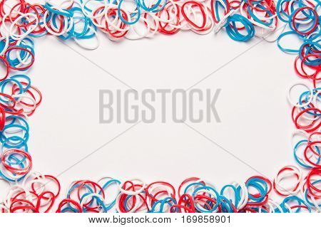 Rubber bands on white background. Office supplies. Assortment of stationery.