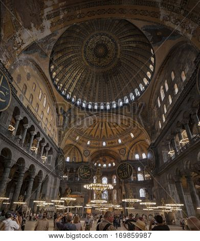 ISTANBUL - SEPTEMBER 02, 2011: Toruist contemplating the Dome of the Hagia Sophia (Ayasofya)which was built in the 6th century.