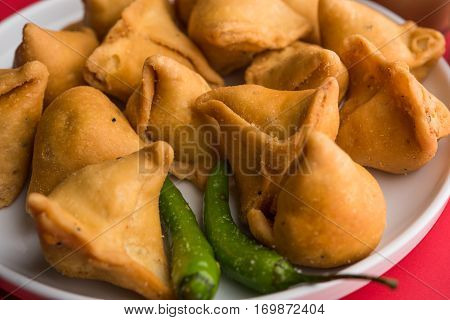 small samosa or mini samosa with sauce and hot tea