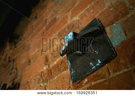 Old dark wrought iron detail wall mounting.