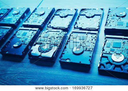 hard disk drives in a rows, blue tone
