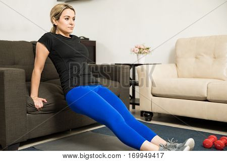 Attractive Young Woman Exercising At Home