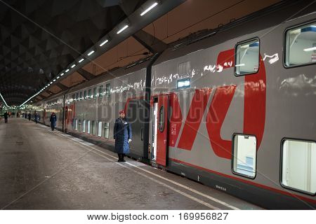 A Woman Train Conductor Standing On The Platform