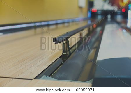 Bowling alley background. Lane with bumper rails closeup. Leisure activity club