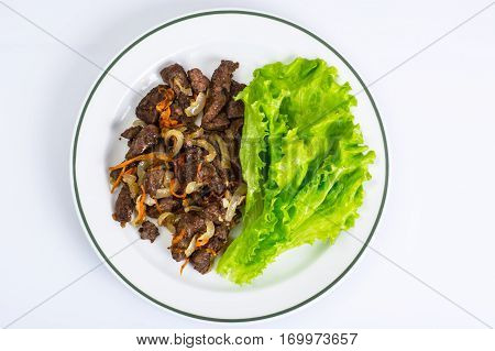 Calfs liver with letucce garnish. Studio Photo