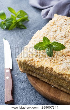 Layered Cake With Cream Napoleon Millefeuille Vanilla Slice With Mint On Dark Background.