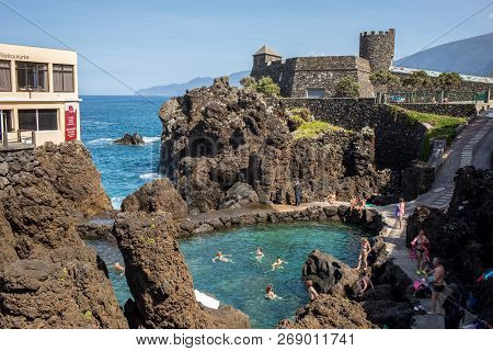 Porto Moniz, Madeira, Portugal - April 18, 2018: Natural Rock Pool Of Porto Moniz On Madeira Island.