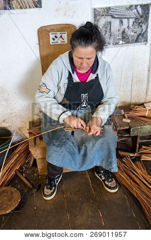 Camacha, Madeira, Portugal - April 19, 2018: A Basket Weaver At Work In The Factory Shop In Camacha 