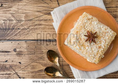 Layered Cake With Cream Napoleon Millefeuille Vanilla Slice With Cinnamon And Anise On Wooden Backgr