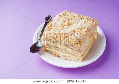 Puff Cake With Cream Napoleon Millefeuille Vanilla Slice Color On Purple Background.