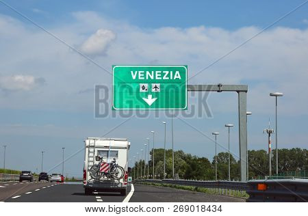 Big Italian Road Sign Indicating Venice And A Camper On The Road. Venezia Means Venice