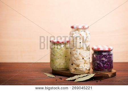 Sauerkraut In A Blue Bowl On A Wooden Table