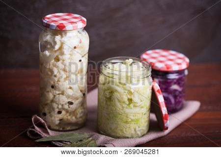Sauerkraut In A Blue Bowl On A Wooden Table