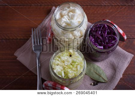 Sauerkraut In A Blue Bowl On A Wooden Table. Top View