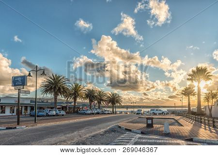 Langebaan, South Africa, August 20, 2018: A Late Afternoon Street Scene, With Businesses And Vehicle