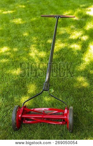 A Full View Of A Reel Lawnmower After  The Restoration Process Was Completed