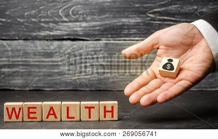 Concept Of Wealth Life And A Happy Well-endowed. Inscription Wealth On Wooden Blocks. High Quality O