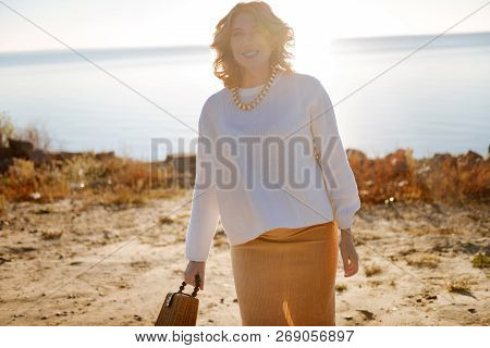 Pregnant Woman Walking Near The River In The Morning