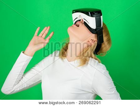 Person With Virtual Reality Helmet Isolated On Green Background. Woman With Virtual Reality Headset.