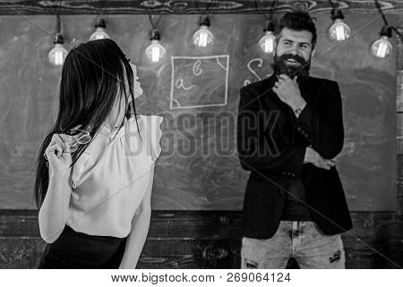 Lady Teacher And Bearded Hipster Schoolmaster Working Together In School. Generation Concept. Man Wi