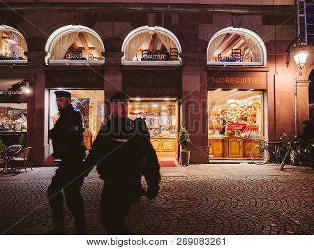 Strasbourg, France - Nov 29, 2017: Two Police Officers In Front Of Candy Sweets Shop In Center Of St