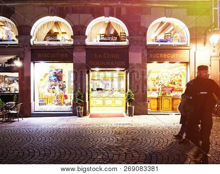 Strasbourg, France - Nov 29, 2017: Two Police Officers In Front Of Candy Sweets Shop In Center Of St