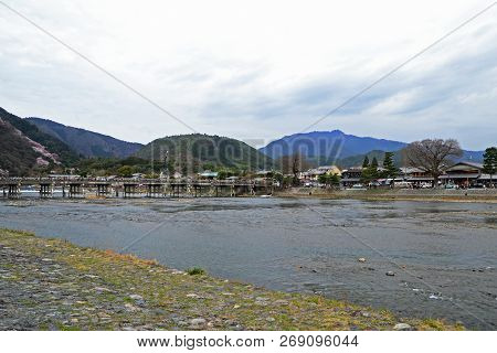Togetsukyo Bridge (crossing Moon Bridge), Admiring The Incredible Views Of The Hozu River Below And 