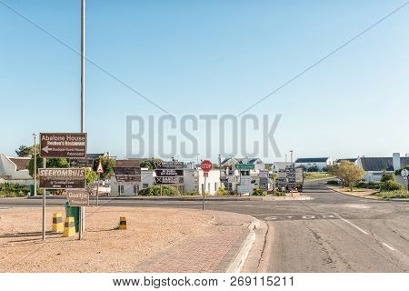 Paternoster, South Africa, August 21, 2018: A Street Scene, With Many Advertisement Signs, In Patern