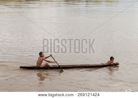 Pantoja, Peru - July 10, 2015: Children On A Dugout Canoe Called Peke Peke On A River Napo, Peru