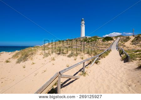 Walkway With Sand Beach To The Lighthouse Of Trafalgar