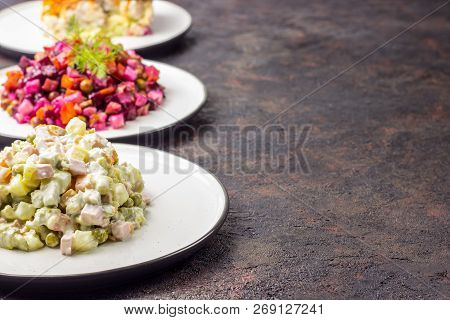 Assortment Salad Of Russian Cuisine - Olivier Salad, Vinaigrette - Beet Salad, Herring Salad.