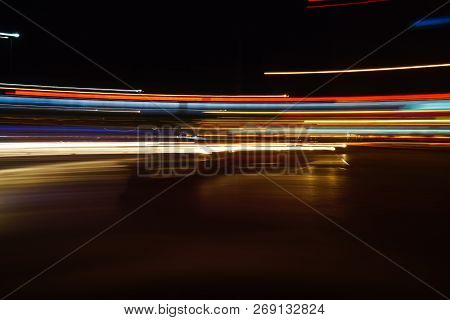 Long Exposured Tail Lights Of Vehicles At Night.