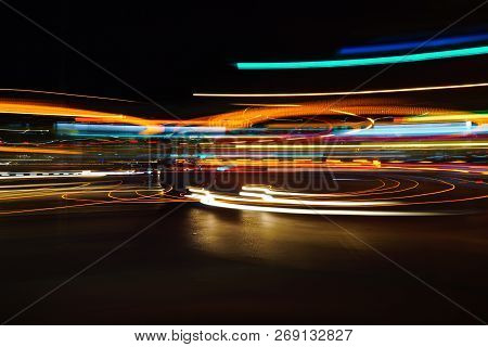 Long Exposured Tail Lights Of Vehicles At Night.