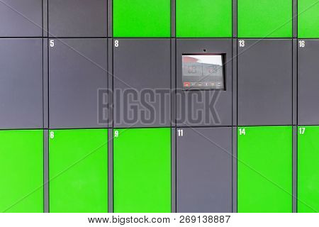 Outdoor Green Automated Public Lockers With Touchscreen Display. Autonomous Post Parcel Terminal.sel