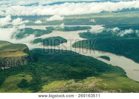 Aerial View Of River Caroni And One Of The Tepuis Table Mountains In Venezuela