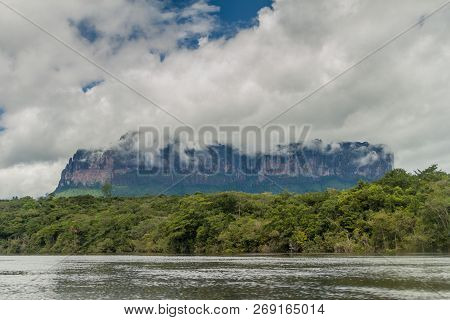 River Carrao And Tepui Table Mountain Auyan In National Park Canaima, Venezuela.