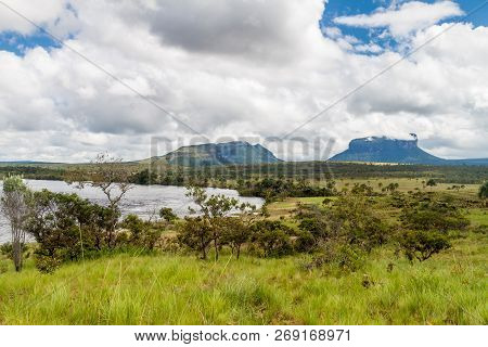 River Carrao And Tepuis Table Mountains In National Park Canaima, Venezuela.