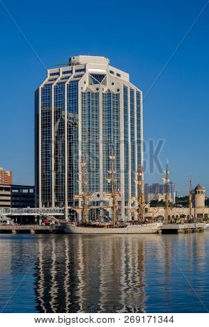 HALIFAX, NOVA SCOTIA, CANADA - AUG 20, 2009: Tall ships docked in the early morning on Halifax's waterfront at Purdy's Wharf during the Nova Scotia Tall Ship Festival.
