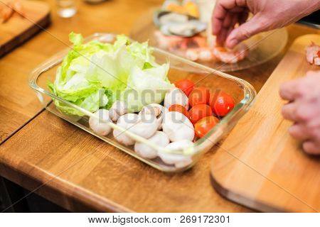 Slice Pizza In Box And Can Of Soda On Wood Background