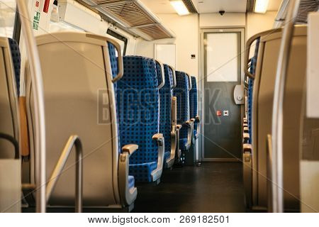 Empty Train Interior In Germany For Moving People For Long And Short Distations. Corridor And A Lot 