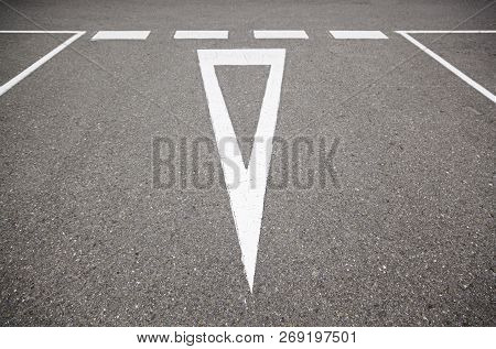 Give Way Sign On The Asphalt, Detail Of An Information Signal In Carratera, Safety And Respect