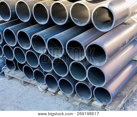 Plastic Pipes In Stock Of Finished Products Stacked In Packs