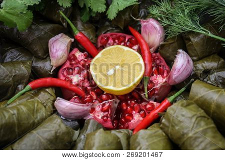 Cooking Dolma With Meat, Pomegranate And Lemon