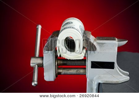low budget concept - dollars in the vice tool