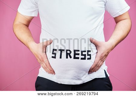 Stress, Eating Problems, Compulsive Overeating, Weight Gain. Overweight Man Holding Big Belly