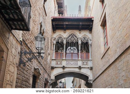 Famous Madieval Bridge Between Buildings In Barrio Gotic Quarter Of Barcelona, Spain